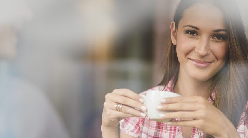 Smiling girl with coffee
